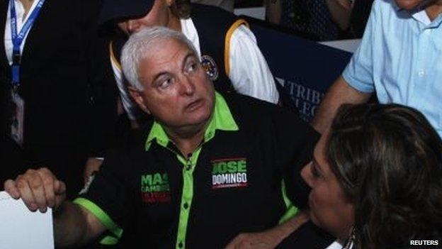 Panama's outgoing President Ricardo Martinelli visits the Electoral Tribunal building after the official election results were released in Panama City on 4 May, 2014