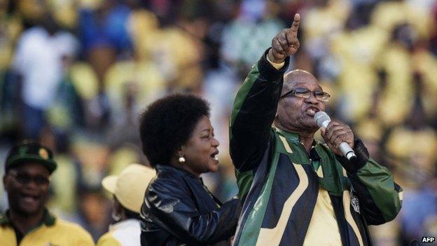 South African President Jacob Zuma (R) sings at the end of his speech during the final ANC election campaign rally at Soccer City stadium in Johannesburg on 4 May 2014