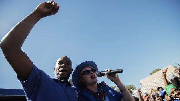 South African opposition party Democratic Alliance (DA) president Helen Zille and DA Gauteng Premier candidate Musi Maimane (L) address a crowd of supporters during an elections campaign rally in Johannesburg Alexandra township on 30 April 2014