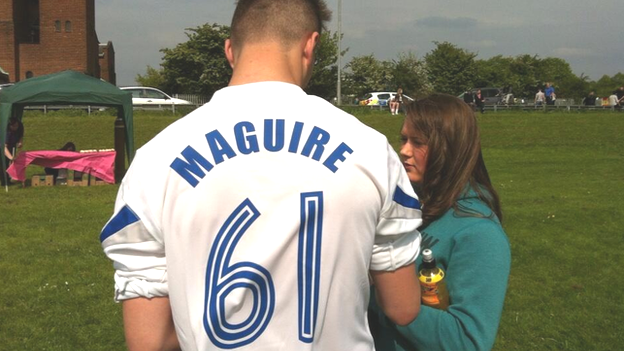 Shirt with "Maguire" printed on the back