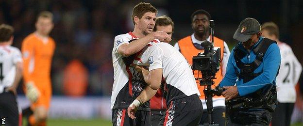 Gerrard puts a consoling arm around a tearful Suarez