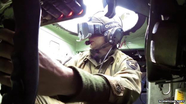 Soldier in a tank wearing Oculus headset