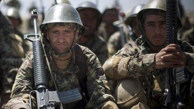 Afghan Army soldiers gather at a military training facility in the outskirts of Kabul, Afghanistan