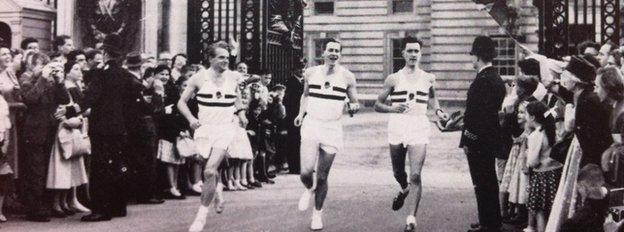 L-R Chris Brasher, Roger Bannister (with baton) and Chris Chataway at Buckingham Palace.