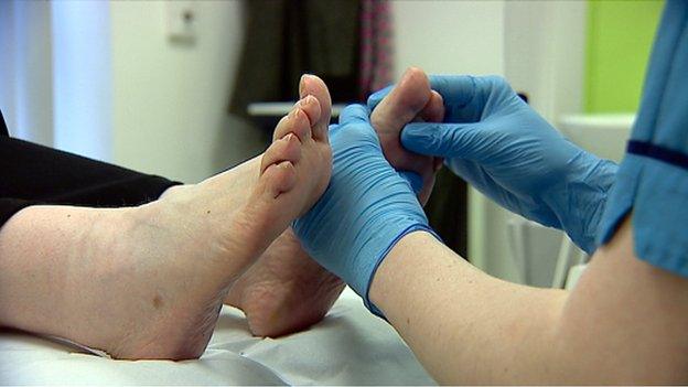 Podiatrist treating patient