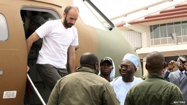 Fr Georges Vandenbeusch disembarking from a plane in Yaounde, Cameroon, 31 December