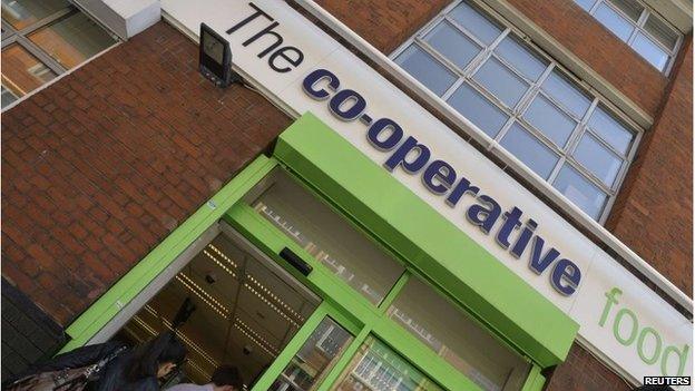 Customers enter a branch of a Co-operative food store in central London April 16, 2014.