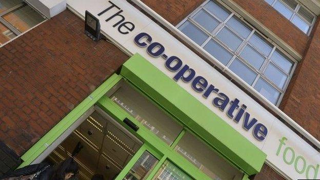 Customers enter a branch of a Co-operative food store in central London April 16, 2014.