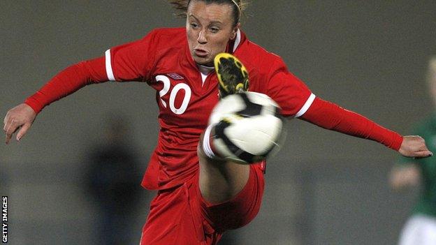 Natasha Harding controls a high ball while playing for Wales