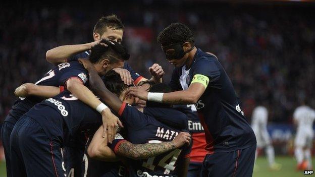 Paris Saint-Germain's players celebrate after scoring against Rennes at the Parc Des Princes stadium in Paris on 7 May 2014