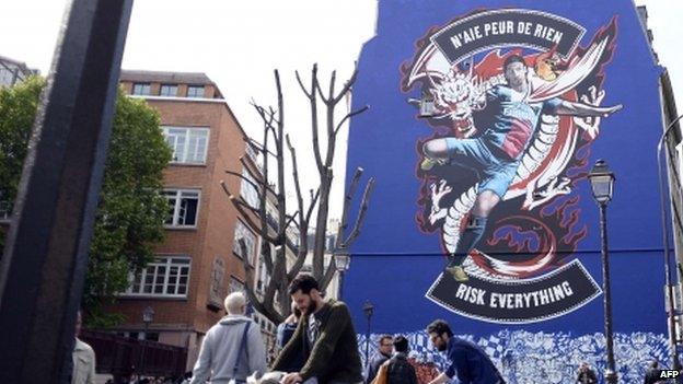 A mural showing Paris Saint Germain football player Zlatan Ibrahimovic on a building in Paris