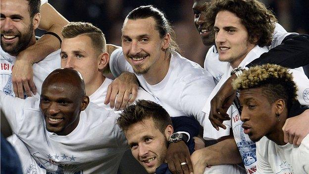 Paris St-Germain players take the acclaim of their supporters after winning their second straight Ligue 1 title