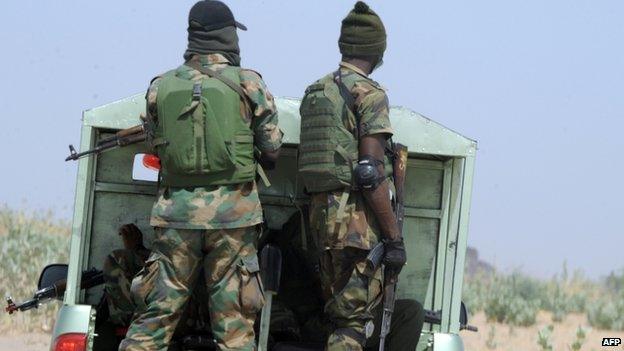 Officers of the Joint Military Task Force (JTF) patrol in the north-eastern Borno state - April 2013