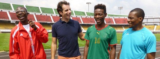 Mark Beaumont (left centre) shares a joke with some para athletes in Cameroon who are preparing for the Games.