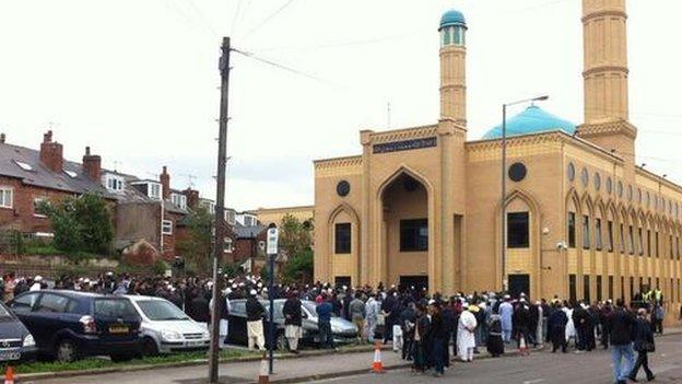 Mourners waiting outside mosque