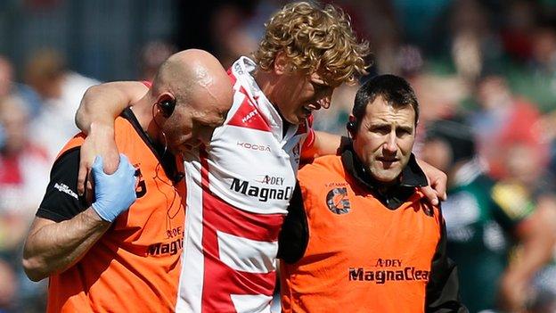 Gloucester's Billy Twelvetrees leaves the field injured