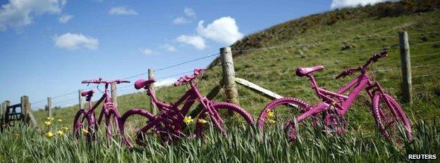 Pink bicycles in a field near the village of Ballintoy