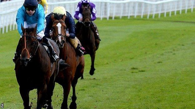 Brown Panther (left) ridden by Richard Kingscote wins the Ormonde Stakes