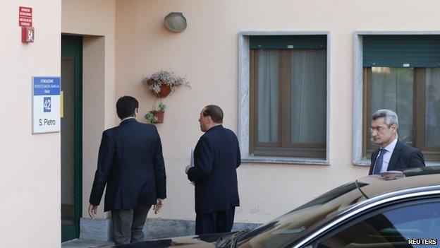 Silvio Berlusconi enters the San Pietro care home in Cesano Boscone (9 April 2014)