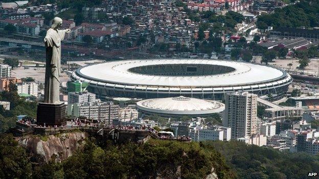 Christ the Redeemer statue atop Corcovado Hill and the Mario Filho (Maracana) stadium in Rio de Janeiro