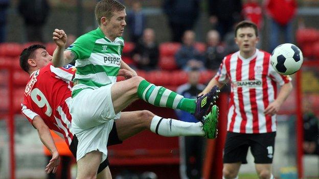 Enda Curran of Derry City challenges Shamrock Rovers opponent Conor McKenna at the Brandywell