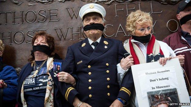 Al Santora (C), father of Christopher Santora, a victim of the September 11, 2001 attack, and other victim"s family members protest the decision by city officials to keep unidentified human remains of the 9-11 victims at the 9-11 Museum at the World Trade Center site, on May 10