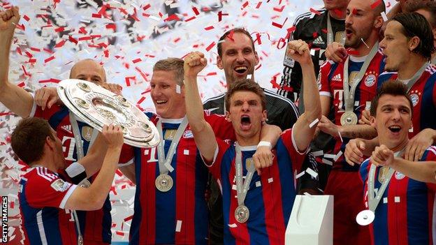 Bayern Munich players celebrate winning the Bundesliga