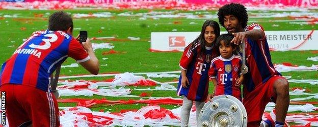 Bayern Munich players celebrate after their final league game of the season