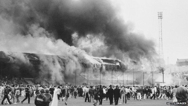 Fire at Valley Parade and fans on the pitch