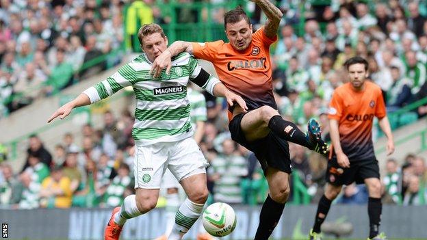 Dundee United's Paul Paton battles with Kris Commons