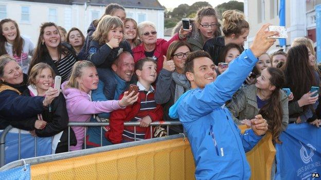 Tom Daley takes selfie with people in St Aubin