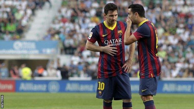 Lionel Messi and Xavi