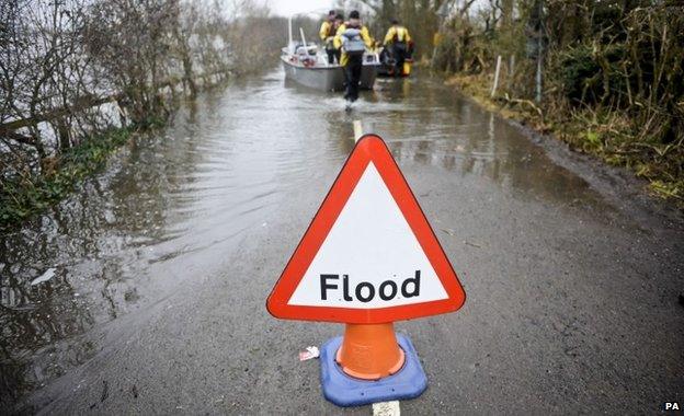 A flood warning sign in the village of Muchelney, Somerset, after it was cut off by flooding in January 2014