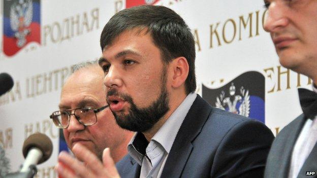 Denis Pushilin (C), the self-styled governor of the so-called "People"s Republic of Donetsk" speaks as Roman Lyagin (R), Chairman of the Central Election Commission and Boris Litvinov, coordinator of the Central Election Commission (L) listen during a press conference in Donetsk on May 12