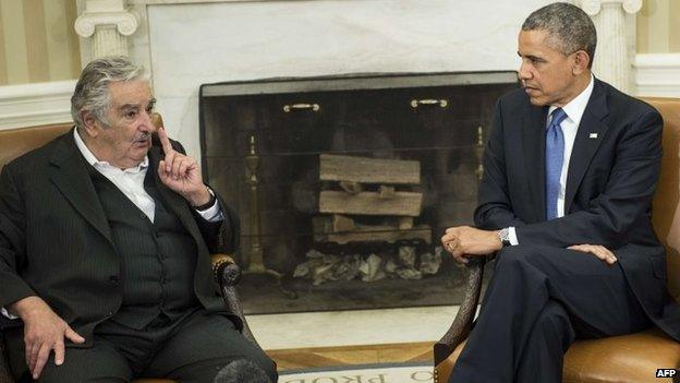 President Obama (R) listens while Uruguay President Jose Mujica speaks to the press in Washington, DC, on May 12, 2014.