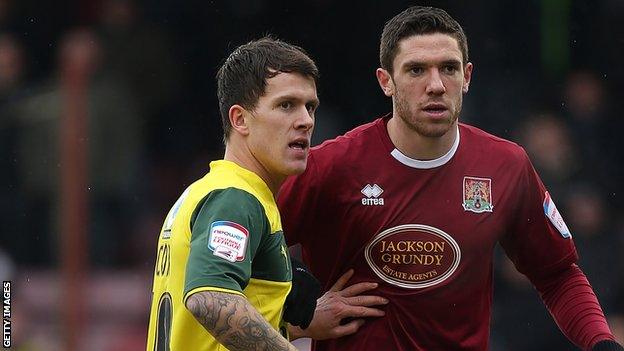 Lee Cox (left) playing for Plymouth at Northampton