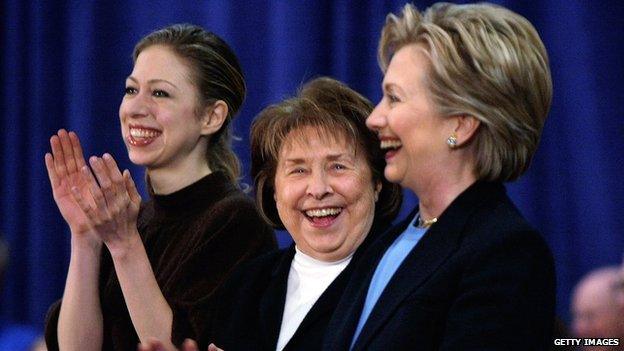 Hillary Clinton and her mother and daughter smile at an Iowa event in January 2008.