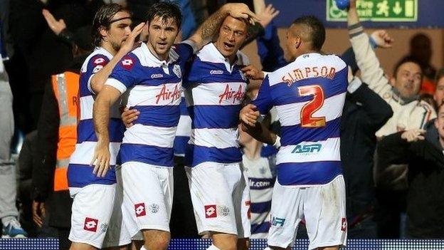 QPR celebrate a Charlie Austin goal