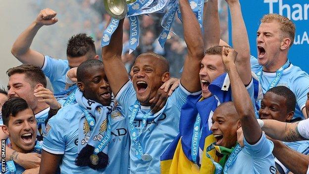 Manchester City players celebrate winning Premier league title