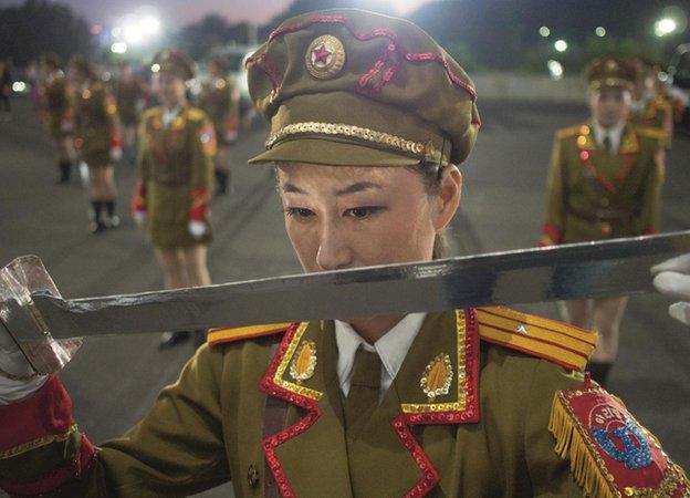 Ri Hyang Yon, 21, dancer in the Arirang Games, during a practice session in the car park, May Day Stadium, Pyongyang