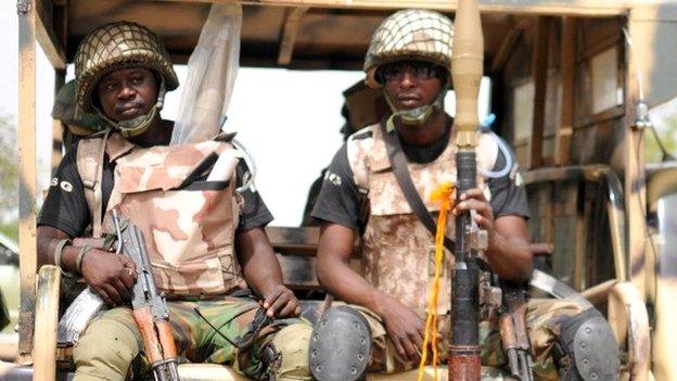 Nigerian soldiers ready for a patrol in the north of Borno state on 5 June 2013 in Maiduguri