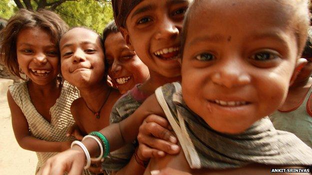 Five young children smiling at the camera