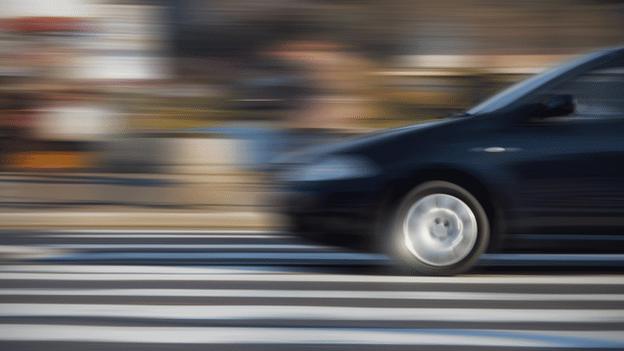 Car blurred on road