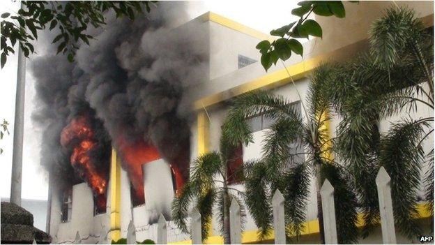 Smoke and flames billow from a factory window in Binh Duong on 14 May as anti-China protesters set several factories on fire in Vietnam, according to state media, in an escalating backlash against Beijing's deployment of an oil rig in contested waters.