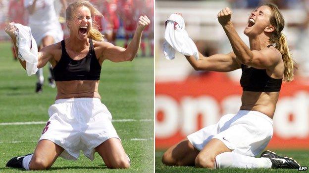 Brandi Chastain kneeling with her bra exposed