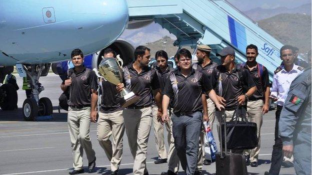 The victorious Afghan cricket team returned to a sombre homecoming