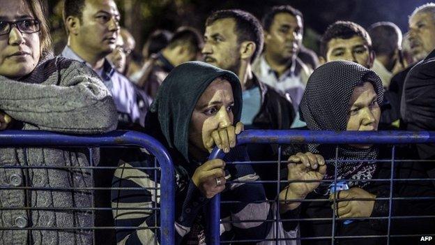 Anxious relatives wait for news of missing miners - 14 May