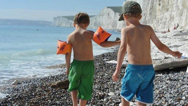 Two children playing on a beach