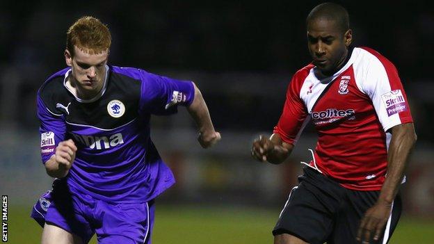 Woking's Adam Newton and Chester's Jamie Menagh