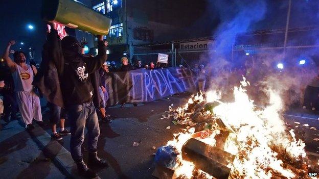 People take part in protests against the upcoming World Cup along the streets of Sao Paulo, on May 15, 2014.